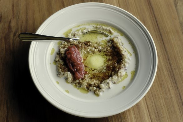 Oat, rye, and buckwheat porridge with cultured butter, brown butter and poached fruit.