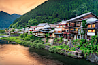 Gujo Hachiman, Japan hot springs town at dusk over the Yoshida River.
