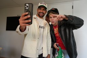 Rabbitohs fan and global superstar Kid Laroi with Cody Walker and Jai Arrow.