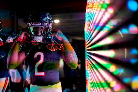 Chicago Bears wide receiver DJ Moore prepares to take the field before an NFL football game against the Minnesota Vikings in Chicago.