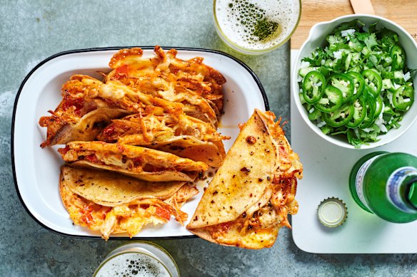 Chilli crisp chicken tacos with coriander rice and salsa.
