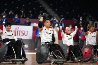 Japan’s Yukinobu Ike (second from left) and teammates celebrate their wheelchair rugby bronze medal in Tokyo.