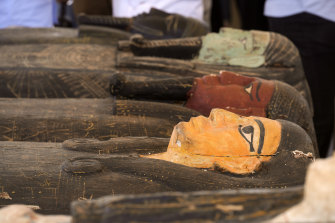 Painted coffins with well-preserved mummies inside, dating back to around 500 BC at a makeshift exhibition at the feet of the Step Pyramid of Djoser in Saqqara, Egypt.