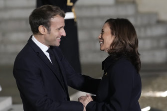 French President Emmanuel Macron welcomes Vice President Kamala Harris at the Elysee Palace.