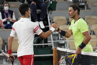 Novak Djokovic and Rafael Nadal shake hands after their semi-final at Roland-Garros last year.