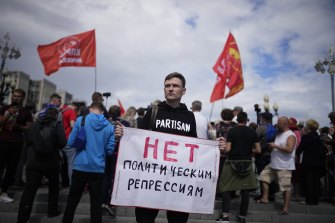 A demonstrator holds a poster reading “No political repressions” during an anti-vaccination protest in the centre of in Moscow in July.