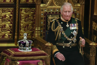 Prince Charles is seated next to the Queen’s crown during the State Opening of Parliament.