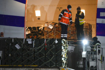 Workers in Kyiv unload a shipment of military aid delivered from the United States on Tuesday.