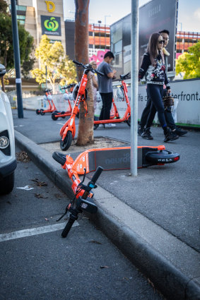 Critics say e-scooters pose a hazard on footpaths.