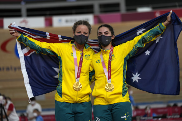 Emily Petricola, left, and Paige Greco enjoy a special gold medal moment.