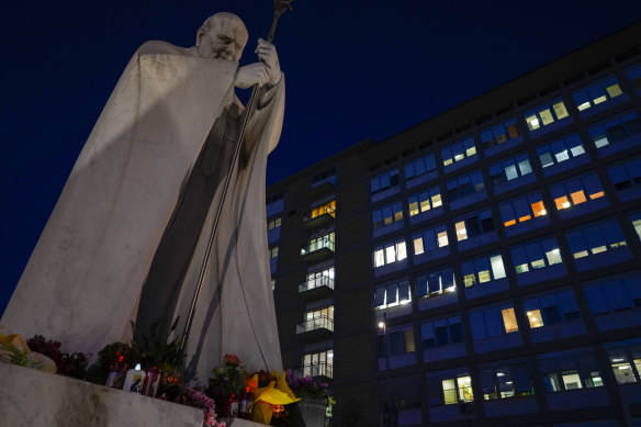 A statue of late Pope St John Paul II in front of Agostino Gemelli hospital in Rome where Pope Francis has been taken.