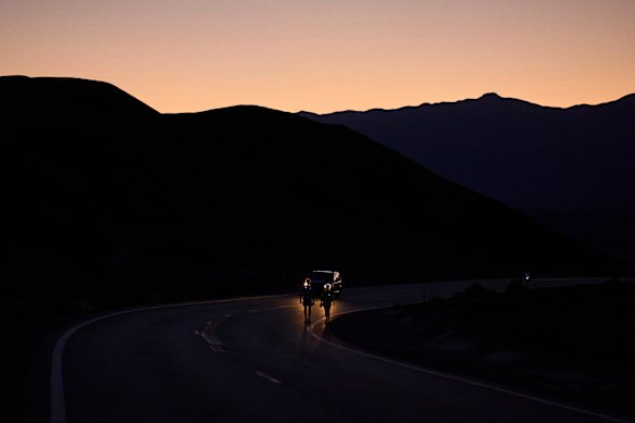 Westergaard, left, competes with pacing help from daughter Madison Westergaard as the sun rises during the Badwater 135 Ultramarathon on July 8.