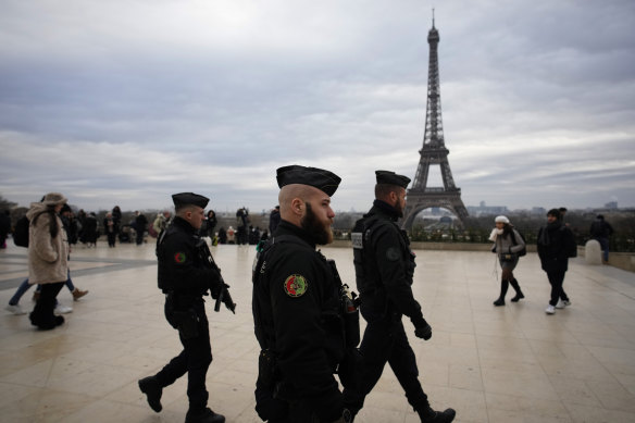 French gendarmes patrol the Trocadero plaza near the Eiffel Tower after the attack.