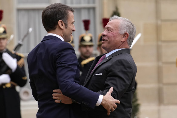 French President Emmanuel Macron, left, welcomes Jordan’s King Abdullah II to the Elysee Palace in Paris on Friday to talk about a ceasefire in Gaza.