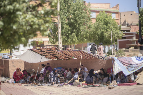 People shelter in tents after their homes were damaged by the earthquake, in the town of Amizmiz, near Marrakesh.