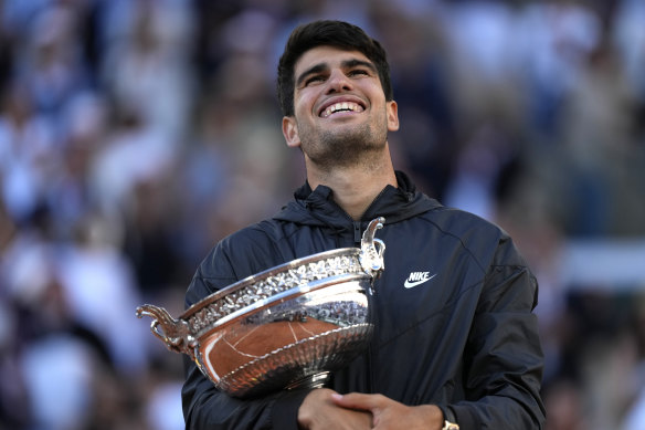 Spain’s Carlos Alcaraz celebrates with the trophy after winning the men’s singles final at the French Open. 