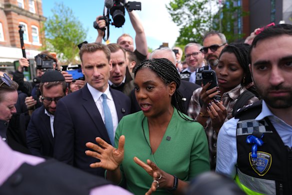Conservative Party leader Kemi Badenoch (centre) speaking with members of the local community at the scene of the stabbings.