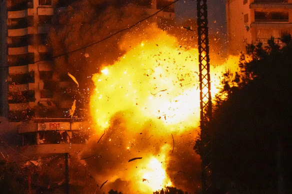 Thick smoke and flames erupt from an Israeli airstrike on Tayouneh, Beirut, on Monday.
