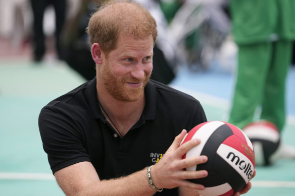 Prince Harry holds during an exhibition sitting volleyball match in Abuja, Nigeria.