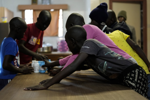 Children pick antiretroviral drugs at the Nyumbani Children’s Home orphanage, which is heavily reliant on foreign donations, in Nairobi, Kenya.