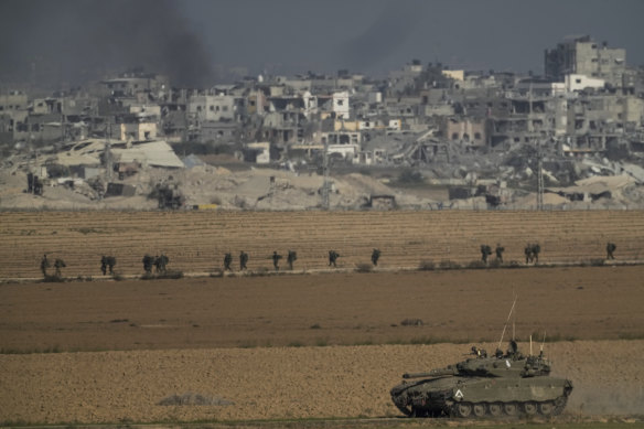 Israeli troops are seen near the Gaza Strip border, in southern Israel.