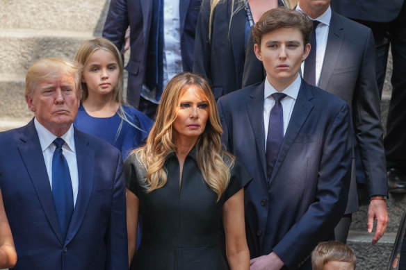 Barron Trump (right), pictured in 2022 with his parents, was largely shielded from the media while he was growing up.