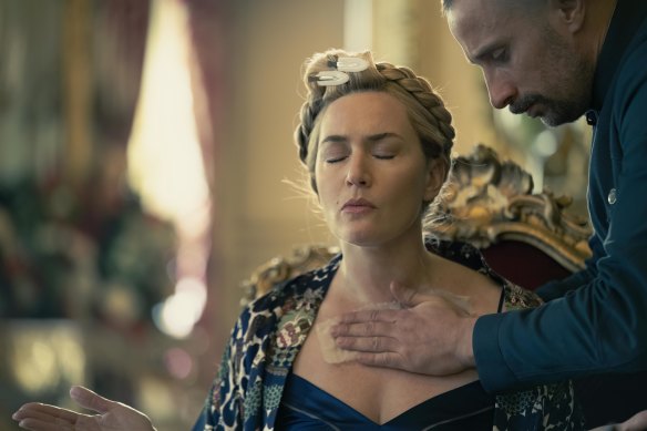 Matthias Schoenaerts’ Captain Zubak panders to his leader’s (Kate Winslet) every whim in The Regime.