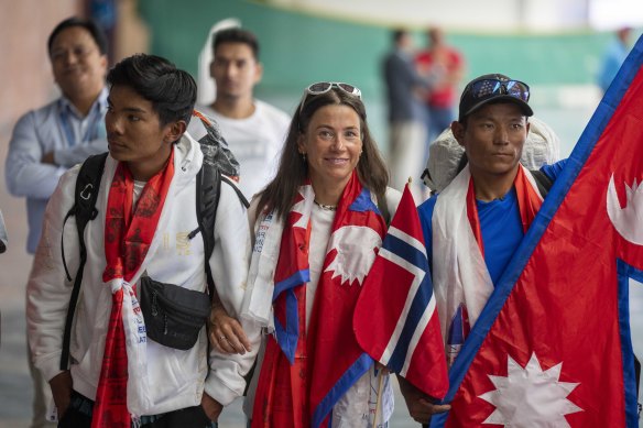 Norwegian mountain climber Kristin Harila (centre) and her Nepali Sherpa guide Tenjen Sherpa (right) who have set a new record by scaling the world’s 14 highest peaks in 92 days.