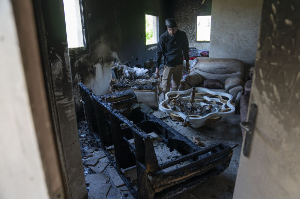 Mohammad Bader, 27, inspects his torched house in the West Bank village of al-Mughayyir. 