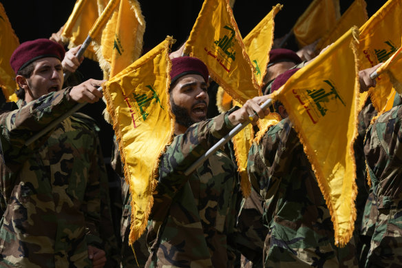 Hezbollah members attend the funeral of two comrades killed on Wednesday when a handheld device exploded.