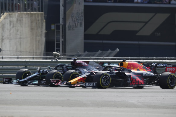 Mercedes driver Lewis Hamilton and Red Bull’s Max Verstappen take a curve side by side.