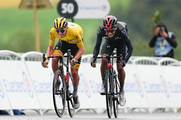 Tadej Pogacar, left, retained the overall leader’s yellow jersey.