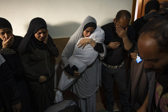 Members of the Abu Draz family mourn their relatives killed in the Israeli bombardment of the Gaza Strip, at their house in Rafah.