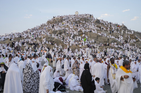 Muslim pilgrims gather at the top of the rocky hill known as the Mountain of Mercy, on the Plain of Arafat, during the annual Hajj pilgrimage, near the holy city of Mecca, Saudi Arabia.