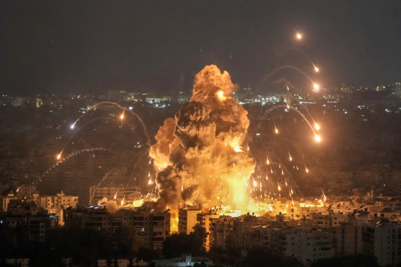 Flames and smoke rise from an Israeli airstrike in Dahiyeh, Beirut, on Sunday night (Monday AEDT).