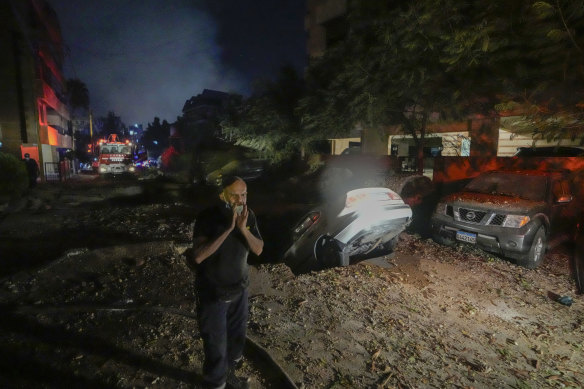 A man reacts at the site of an Israeli airstrike in Beirut’s southern suburbs on Friday.