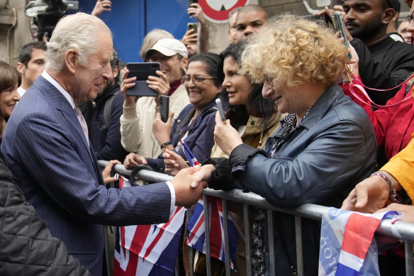 Charles greets the public near the Queen Elizabeth II Flower Markets in Paris.