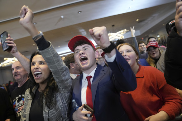 Trump supporters cheer at an election night rally for the former president.