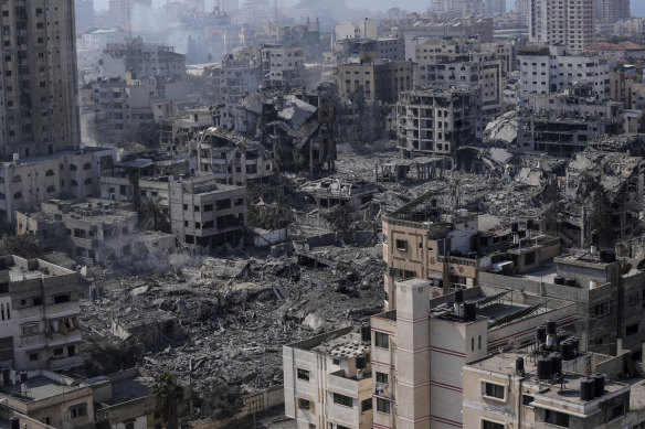 Destruction from Israeli aerial bombardment can be seen in Gaza City on Wednesday.