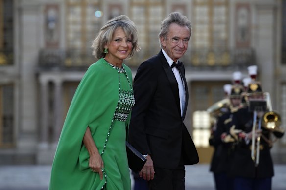 LVMH CEO Bernard Arnault and his wife Helene Mercier. Arnault was also accused of banning Hermes ties from the office.