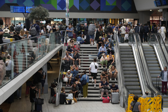 Travellers face delays at the Gare de Montparnasse station in Paris.
