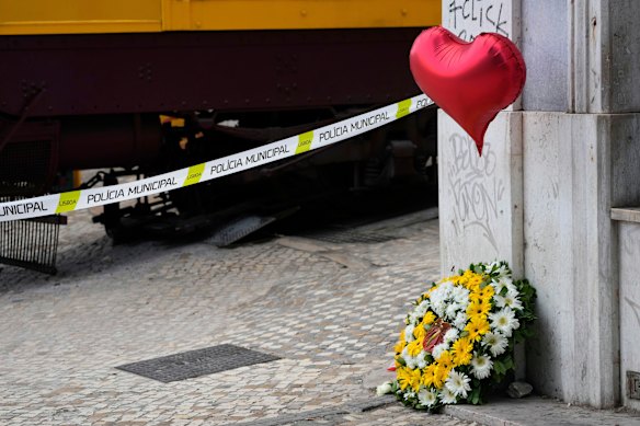 A makeshift memorial next to the site where the streetcar derailed and crashed.