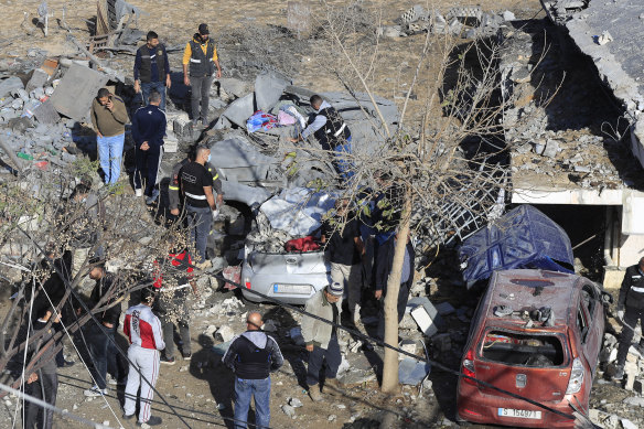 Lebanese Army Intelligence members inspect an army position that was damaged in an Israeli airstrike on Tuesday night, in Sarafand, southern Lebanon.