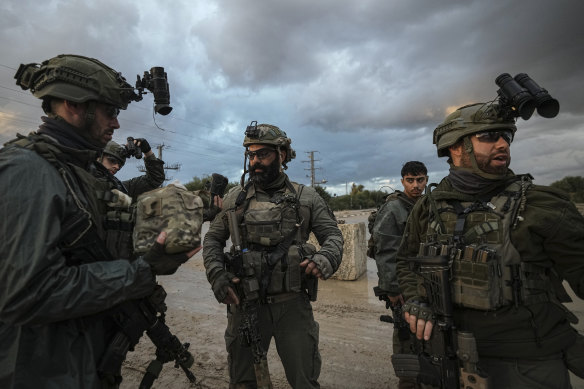 Israeli soldiers prepare to be deployed to the Gaza Strip.