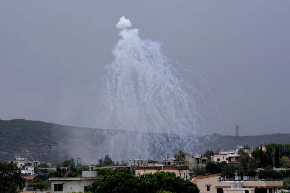 A shell from Israeli artillery explodes over Aita al-Shaab, a Lebanese border village with Israel.