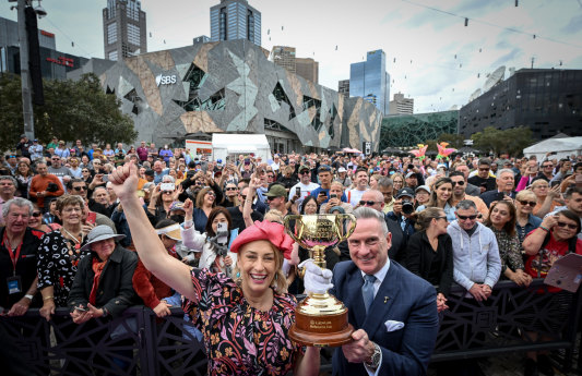 Melbourne Lord Mayor Sally Capp and Victoria Racing Club chairman Neil Wilson with the Melbourne Cup parade crowd at Federation Square.