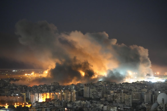 Flames and smoke rise form Israeli airstrikes on Dahiyeh, in the southern suburb of Beirut on Sunday.