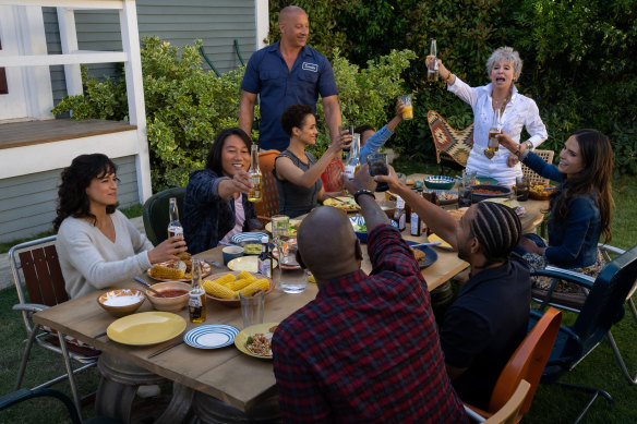 Family is everything to Dom in Fast X: (clockwise from left) Letty (Michelle Rodriguez), Han (Sung Kang), Ramsey (Nathalie Emmanuel), Dom (Vin Diesel), Little Brian (Leo Abelo Perry), Abuelita (Rita Moreno), Mia (Jordana Brewster), Tej (Chris ‘Ludacris’ Bridges) and Roman (Tyrese Gibson). 