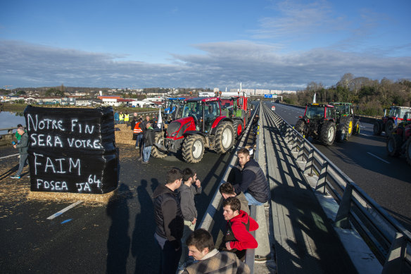 Farmers have for months been protesting for better pay and against what they consider to be excessive regulation, mounting costs and other problems. Playing with words banner reads: “Our end will be your hunger”.