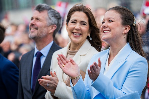Princess Isabella (right) with her parents, the King and Queen of Denmark.